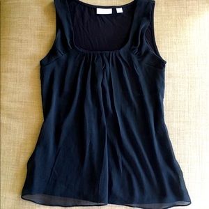 Black shell with chiffon overlay in front. Size S